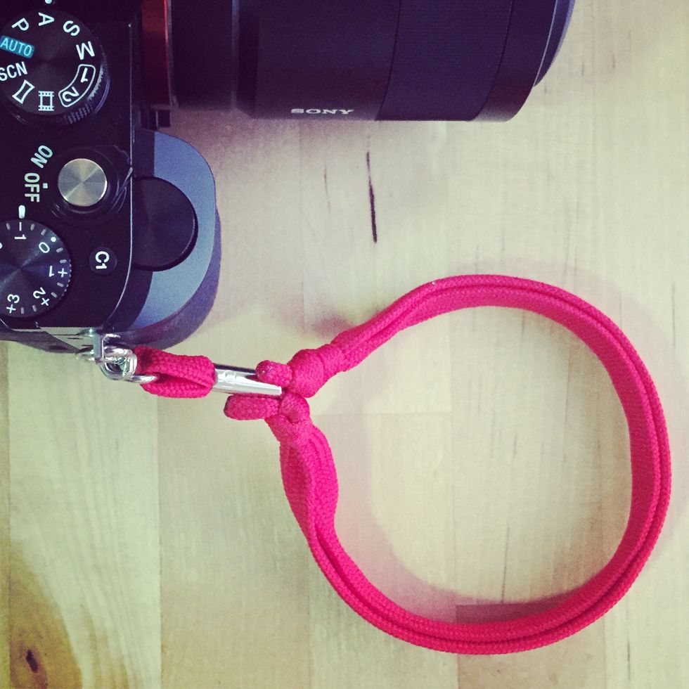 Finished strap attached to camera tightened.