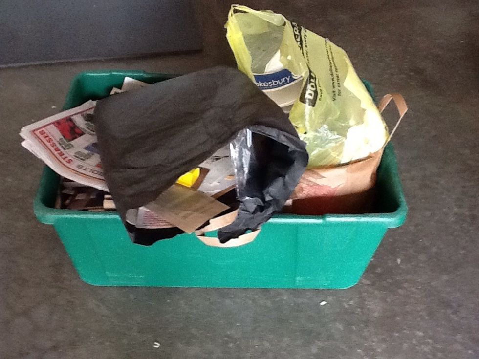 Finished tub ready to take to the paper bin. The two plastic bags visible here were removed before the waste paper was put into the bin.