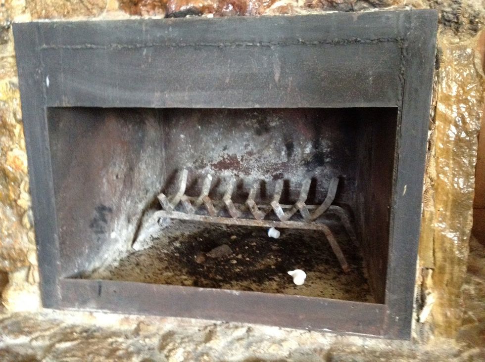 Fire place that as a thing that holds wood (day2). We were Inside a house