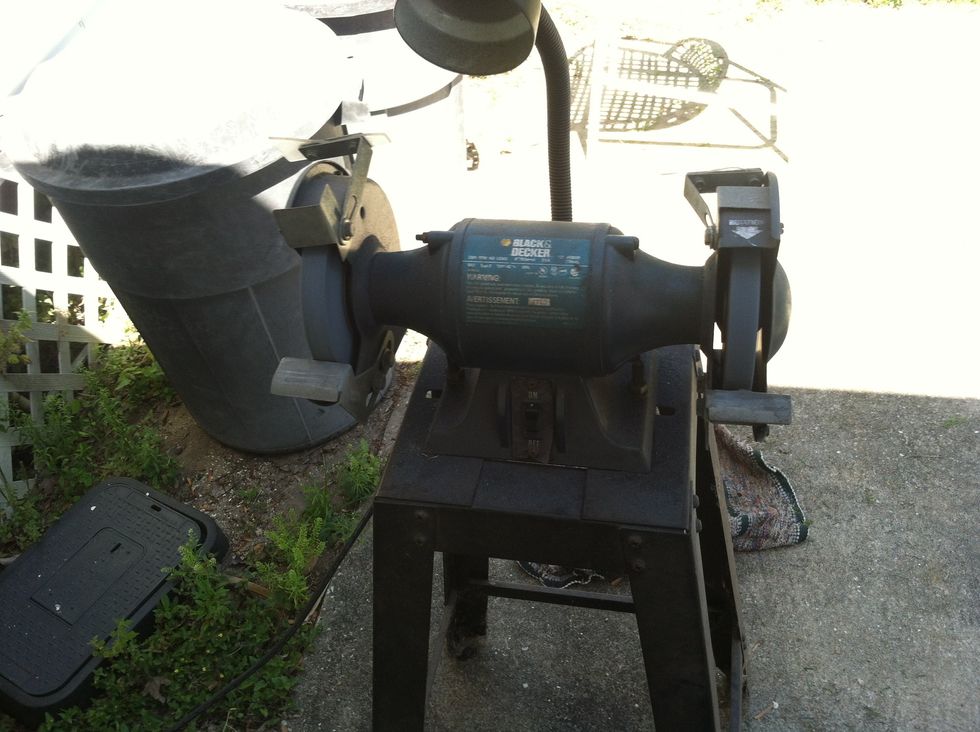 fire up the grinder. from here on SAFETY GLASSES are mandatory, watch where your sleeves are too, this grinder has 2 rotating wheels, they remove metal or flesh with equal aplomb