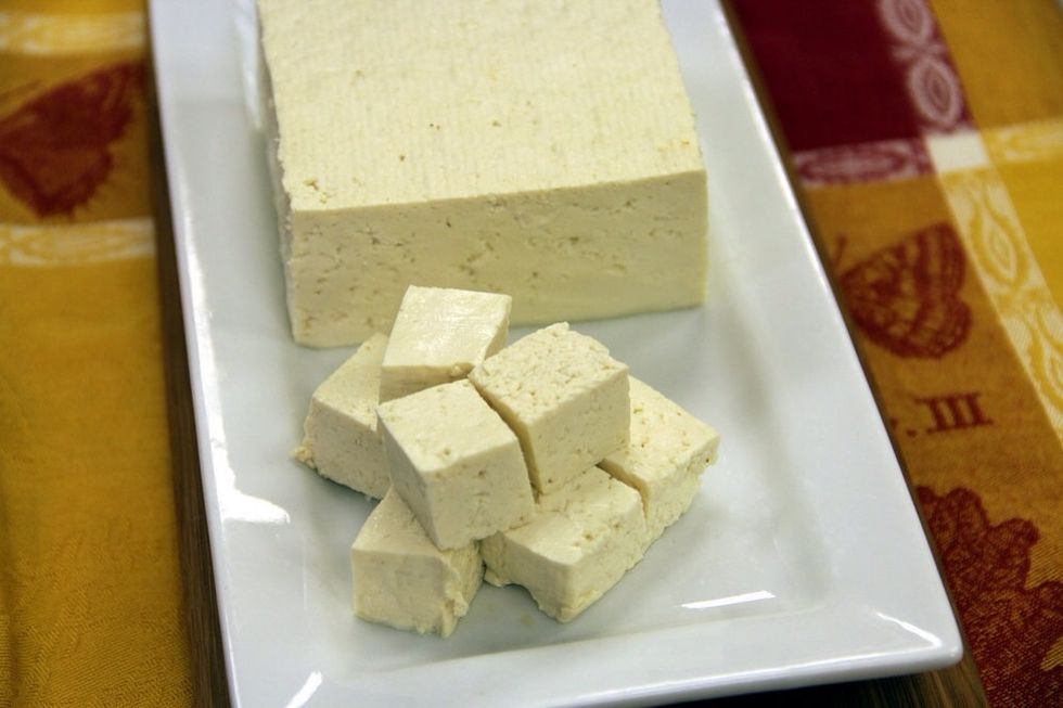 Firm tofu has a soft, spongy texture that is perfect for marinating. Here we have cut it into cubes.