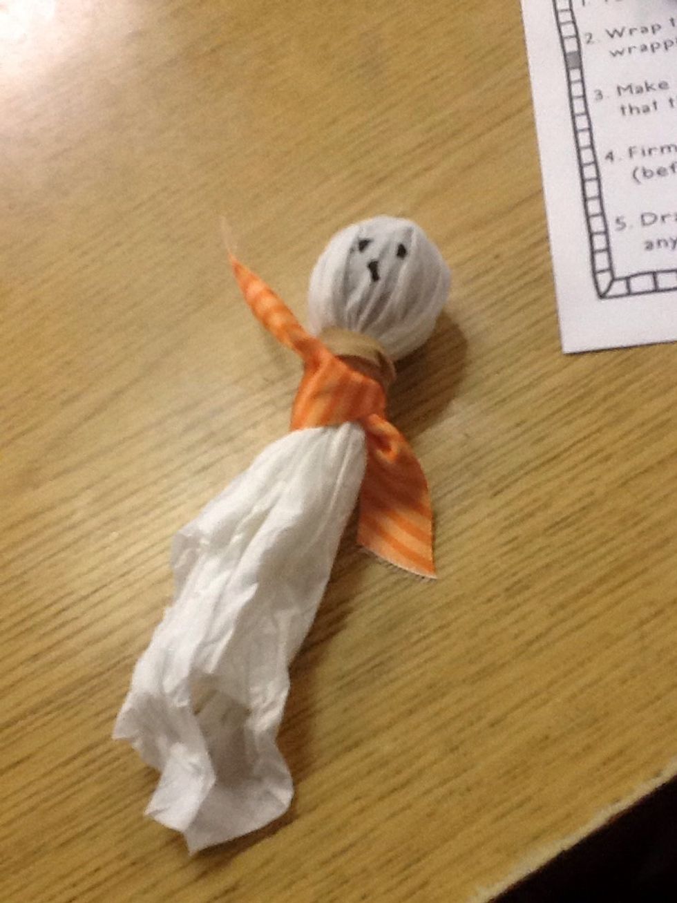 Firmly grip the tissue at the bottom of the actual lollipop (before the step).tie the rubber band around.draw a kind of face on the upper part of the lollipop you can do any kind of face that you like