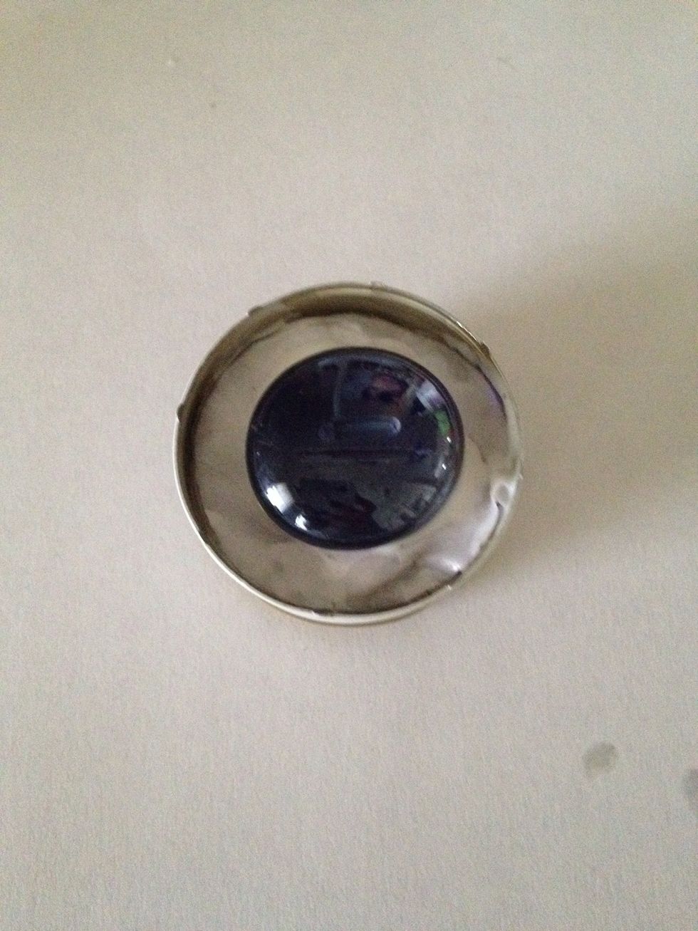 Firmly press the gem on top.