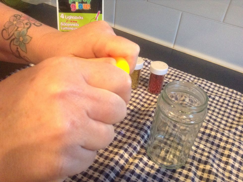 First, activate the glow stick by snapping it.