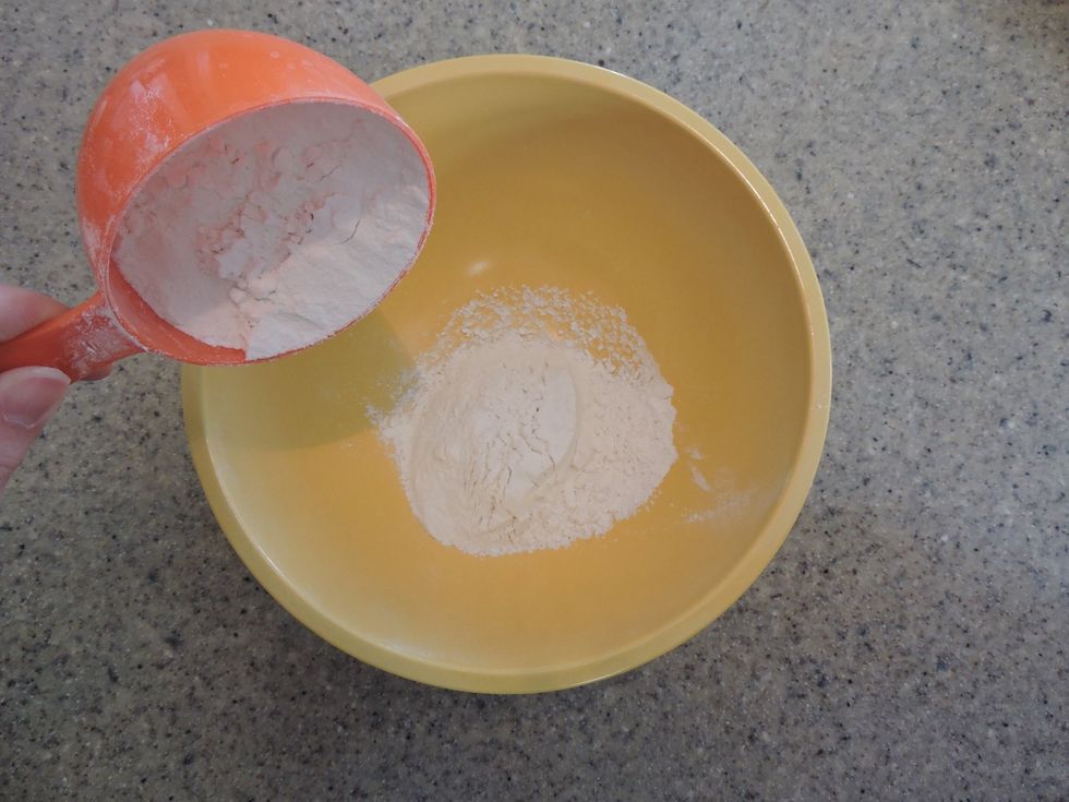 First, add flour to a large mixing bowl.