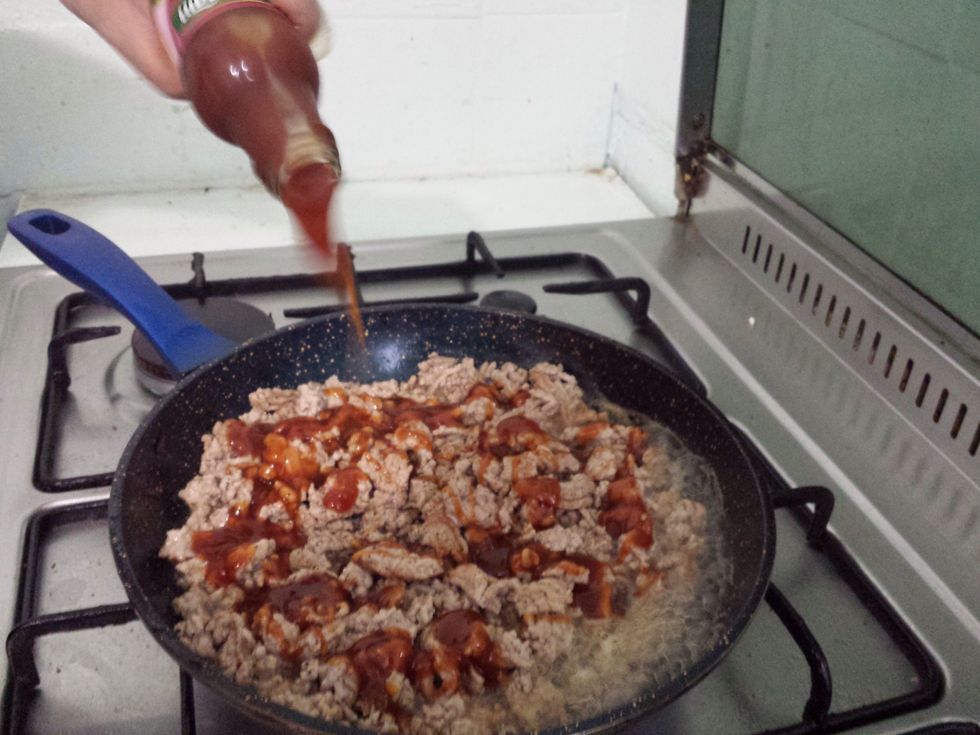 First add in about 150ml if the Hoisin sauce then stir. Then add about 100ml of the sweet chilli sauce then stir.