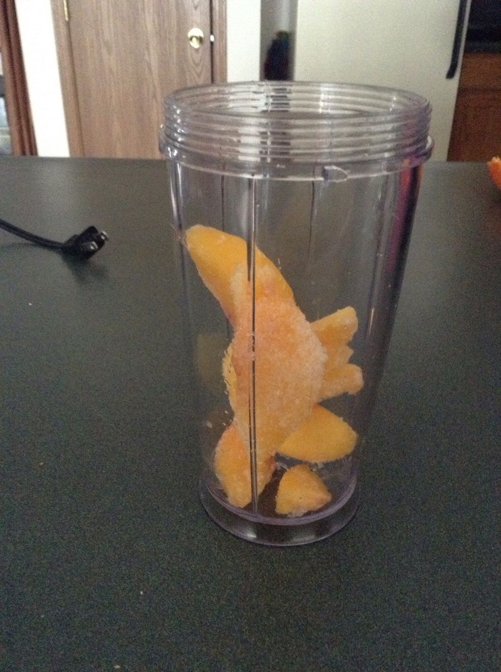 First add in your frozen peaches