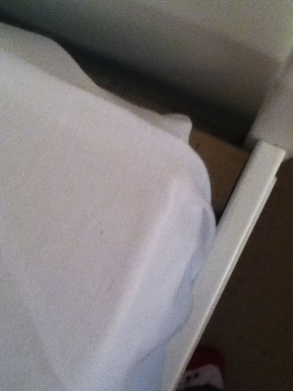 First, add your tight fitting sheets to the bed and tuck in the corners really well.