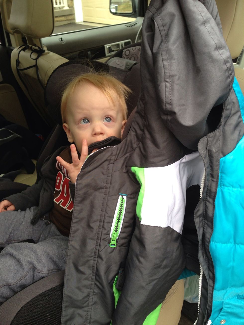 First and foremost, remove snow suit and/or winter jacket. It is never safe to have a child in a car seat with a puffy jacket. Instead, use a blanket or a thin fleece jacket or sweater.