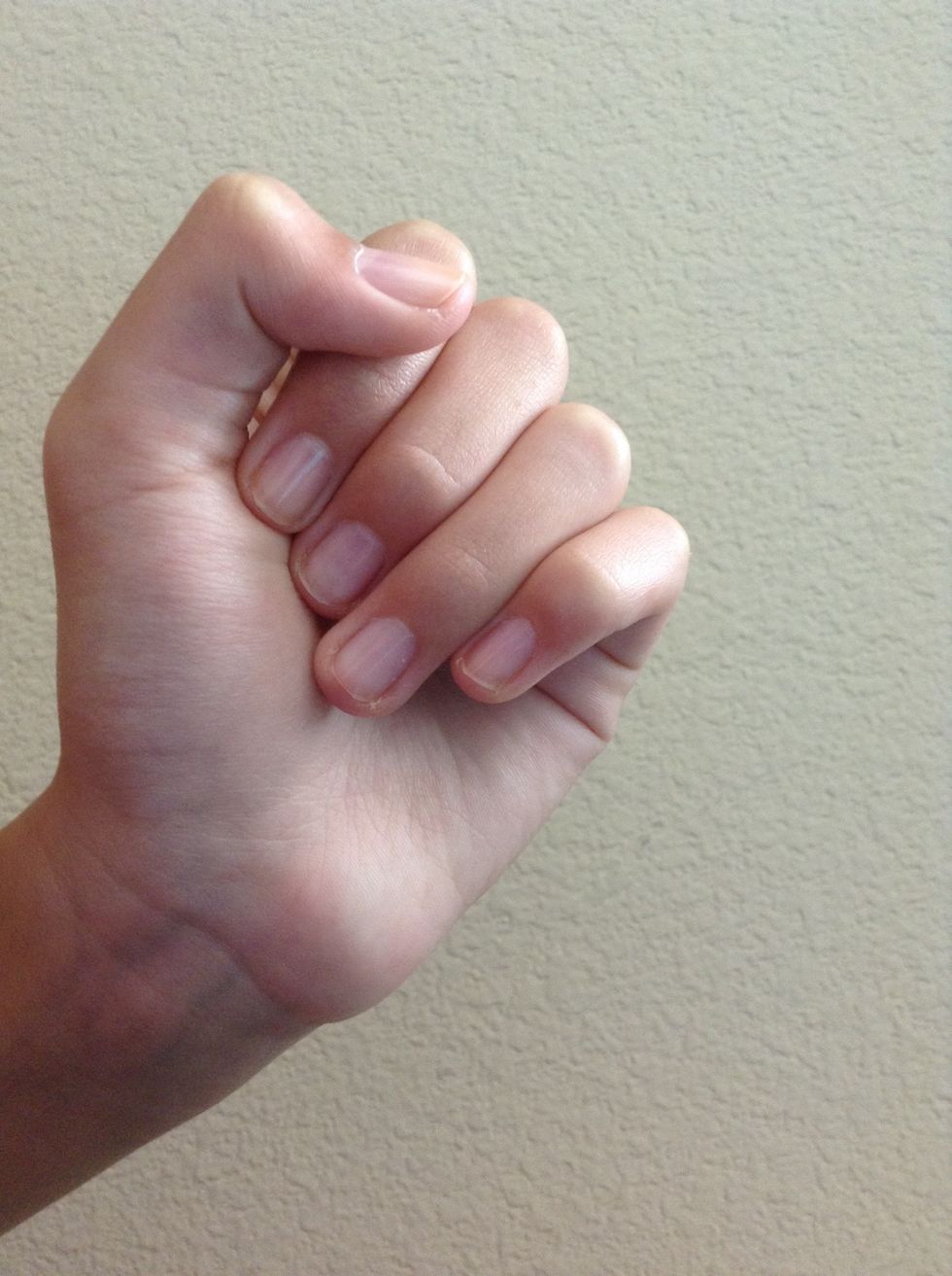 First apply a base coat to all of your nails