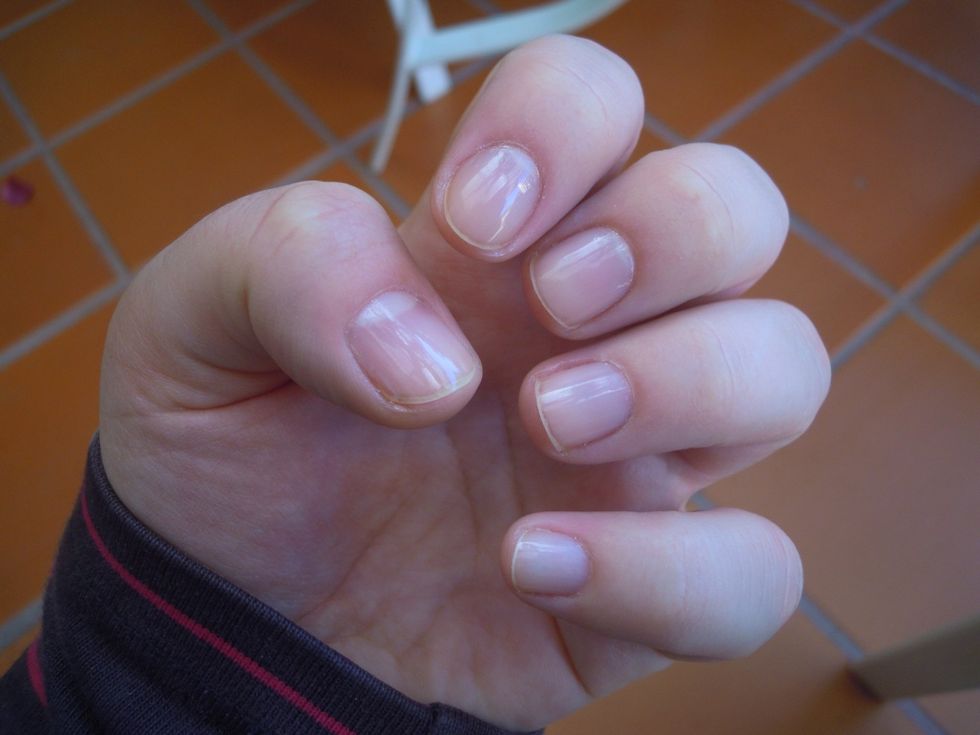 First apply a base coat to protect your nails.