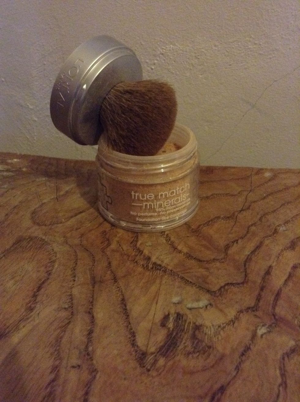 First, apply a suitable shade of powder to your face , making small stippling motions with the brush.