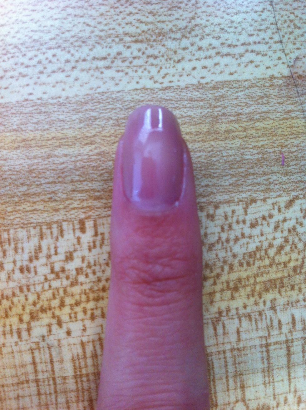 First, apply base coat. Then, paint your nails a light purple.