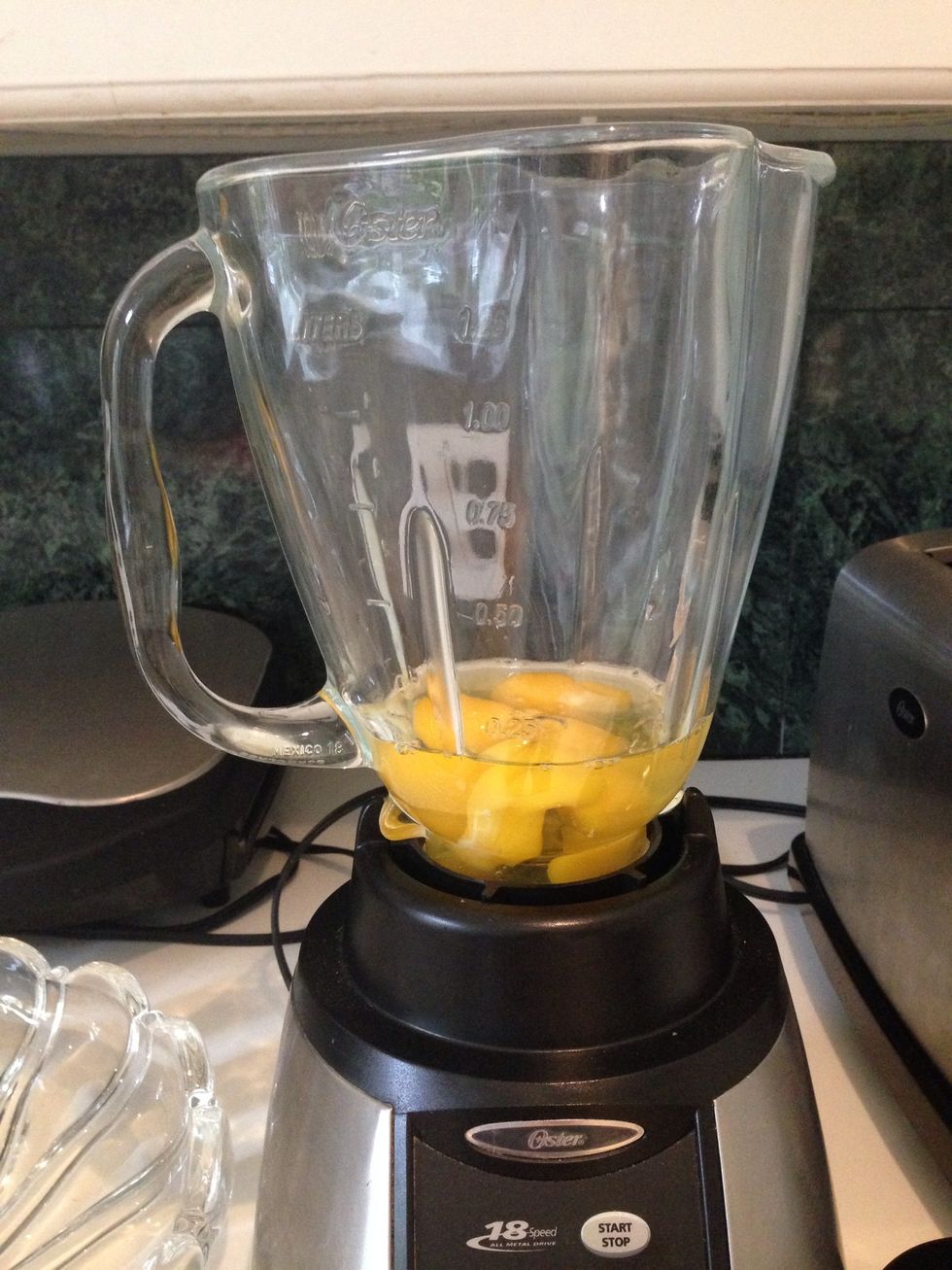 First, Break 4 eggs into the blender.
