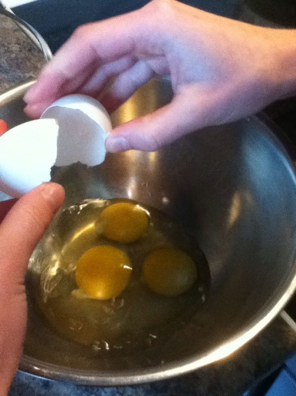 First, break the eggs into a bowl.