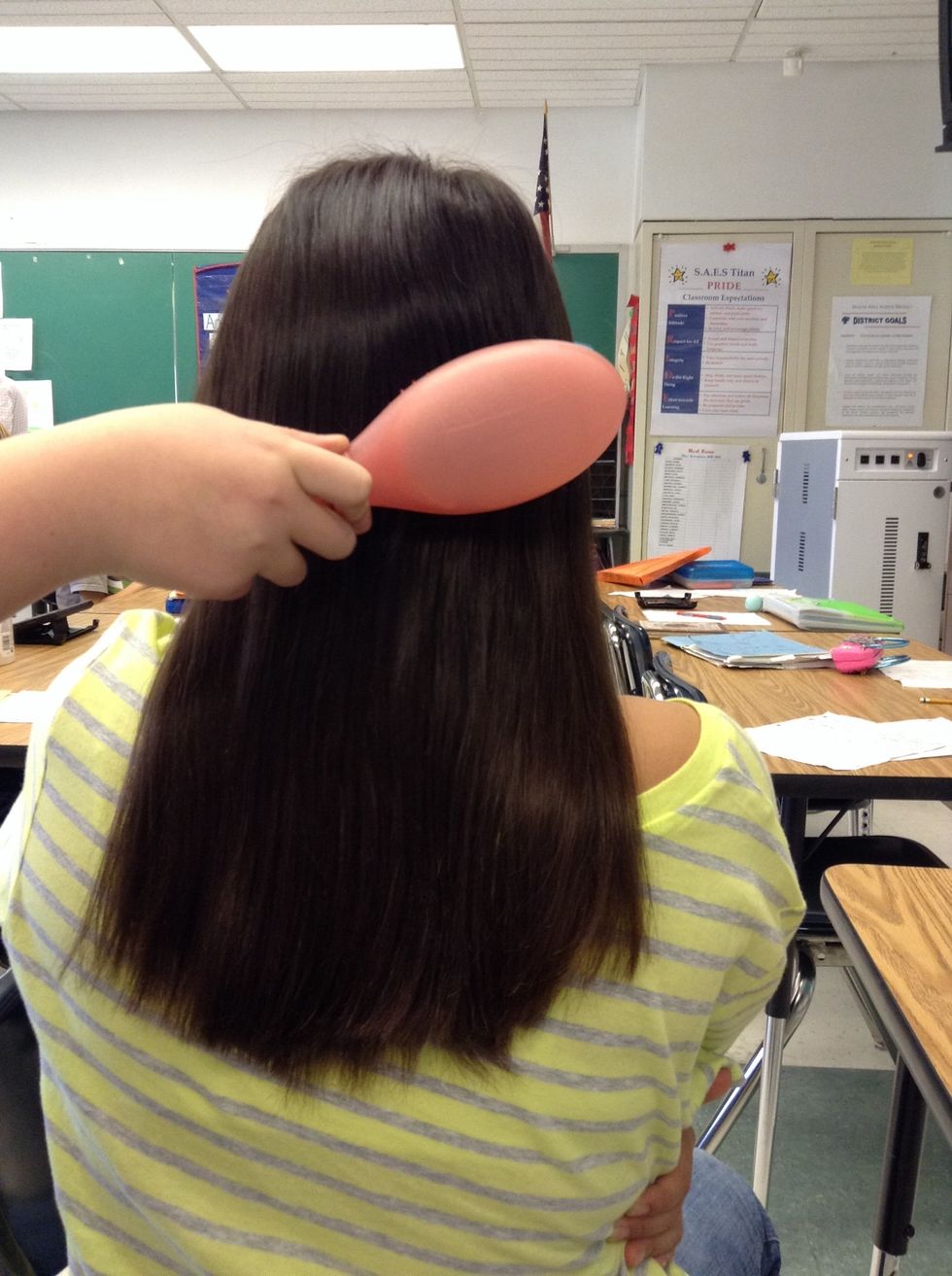 First, brush your hair, so it is easier to braid.