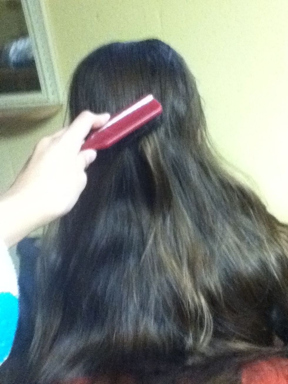 First, brush your hair so that it is smooth and tangle-free