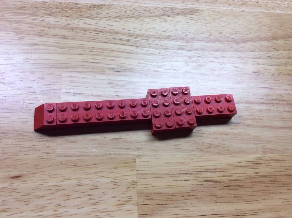 First, build the base of the jet. Use the longer piece for stability.