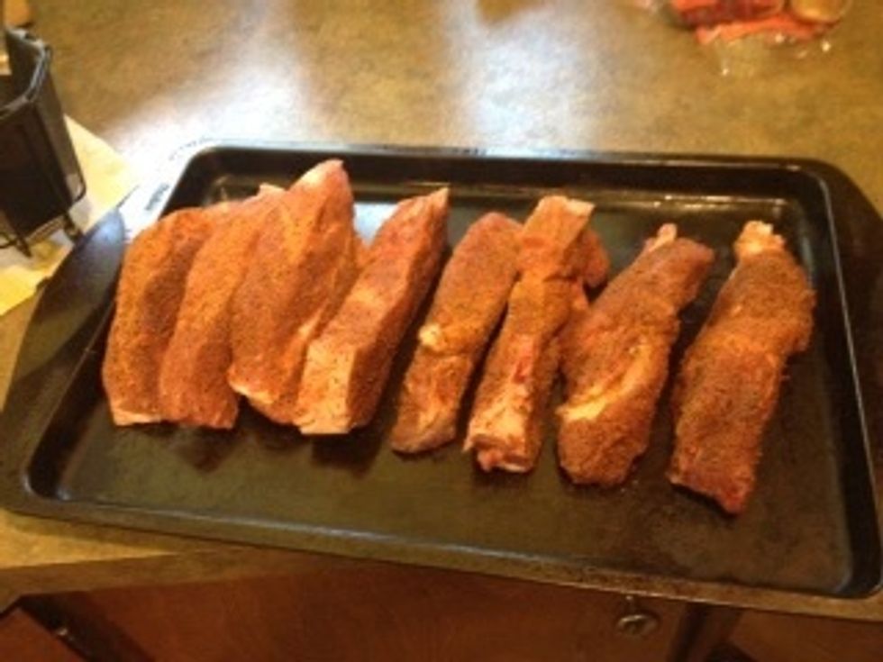 First, buy a good BBQ rub and season all sides of the meat. Top, bottom, and sides.