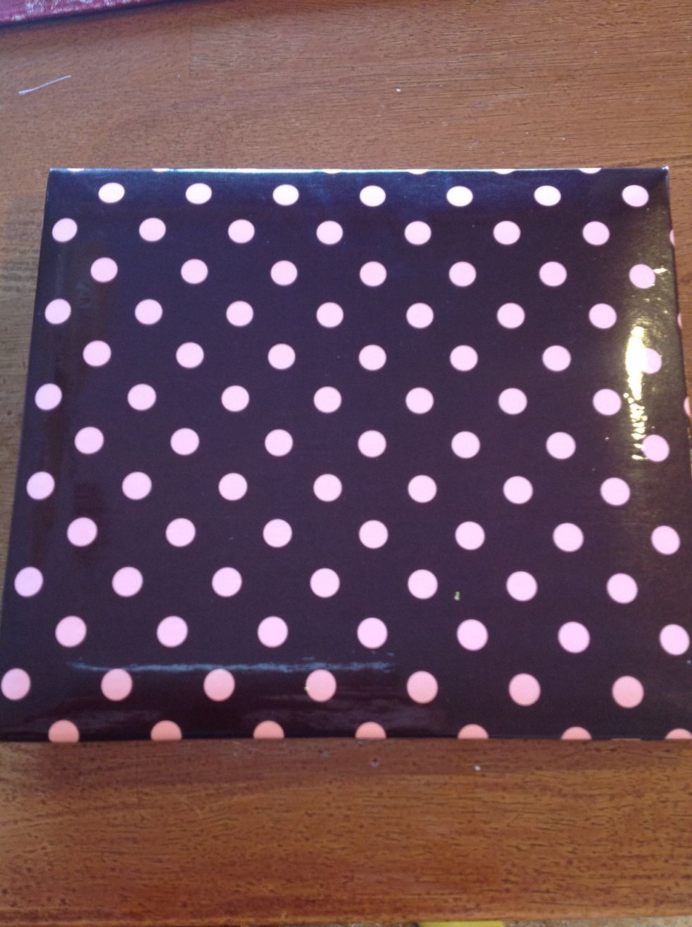 First, buy a scrapbook of your choice