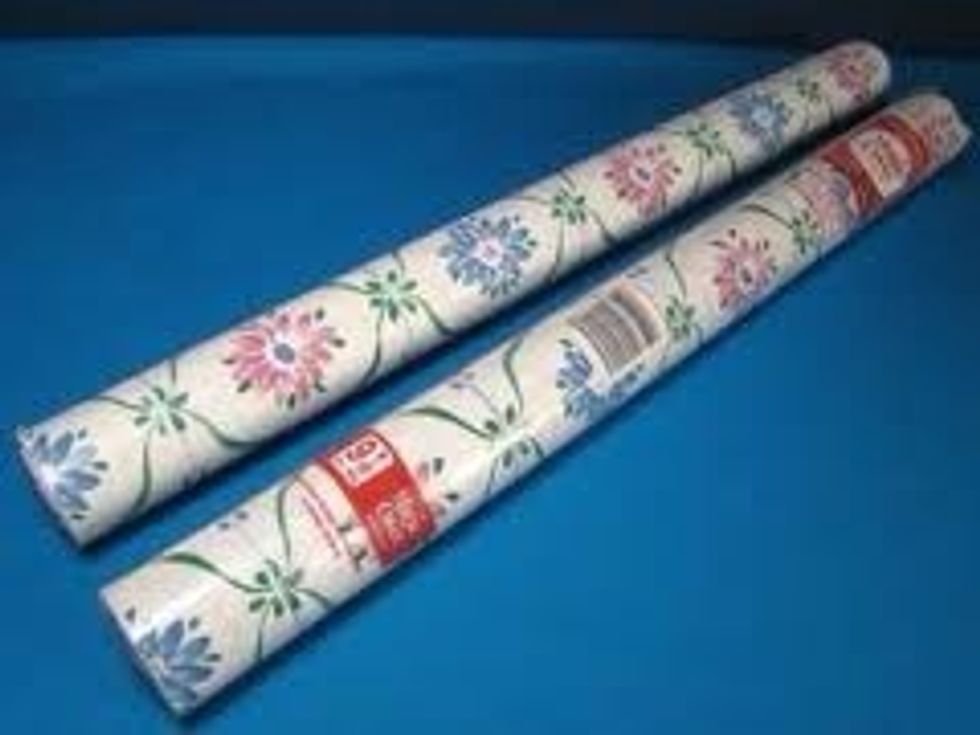 First, check out your local dollar store (mine was Dollar Tree) and find vinyl self adhesive drawer liner. It comes in lots of different designs and colours!