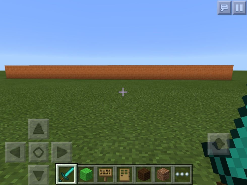 First, choose your block. (I choose orange wool) and place it as high as you want.