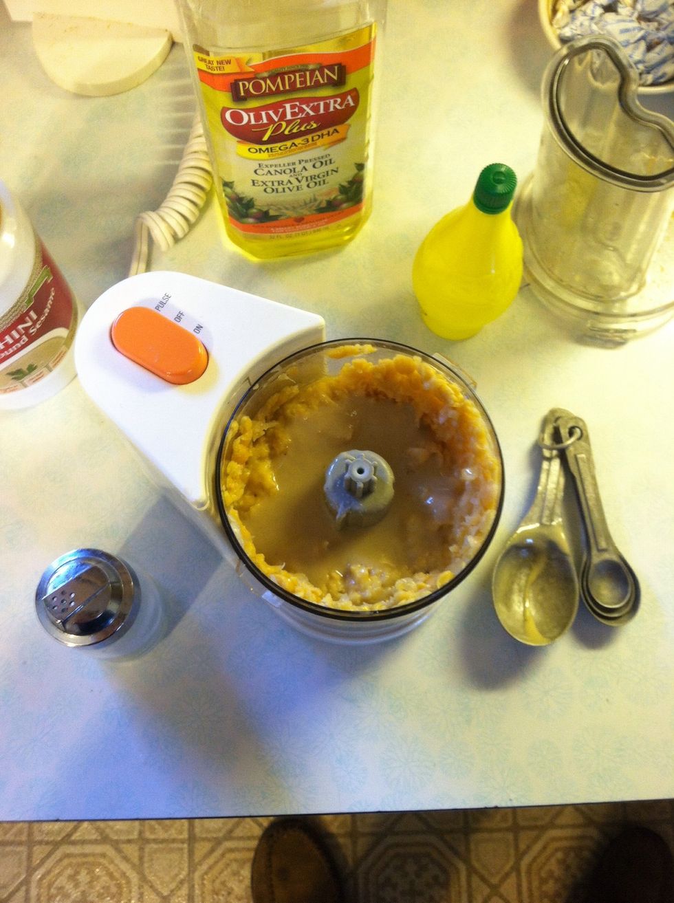 First, chop up the chickpeas in a food processor. Then mix in the rest of the ingredients and blend away!