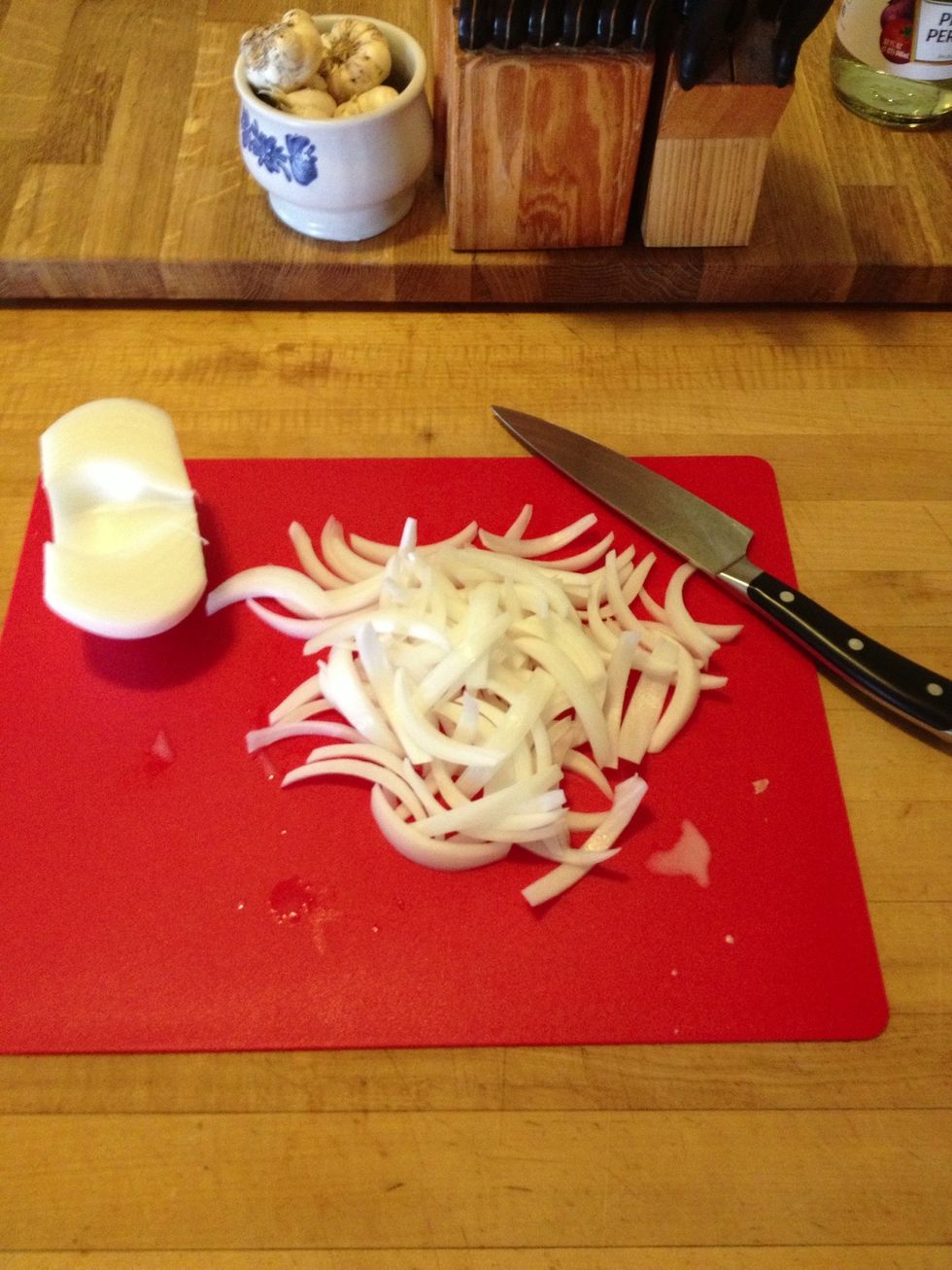 First chop your onions and cucumbers. I like the onions to be a bit thicker. Slice the cucumbers however you like. I'm doing a standard pickle chip thickness for this batch, but spears work well too.