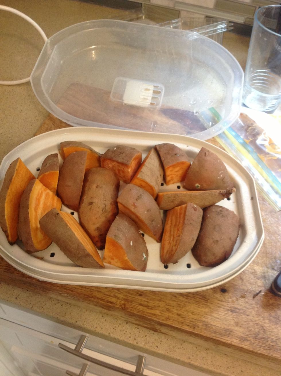 First, clean, slice up, and  steam or boil the sweet potatoes.  I like to use this handy-dandy microwave steamer, but you can do it any way you want!  I also like to leave the skin on, it's good!