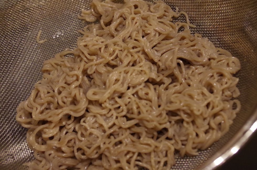 First cook your ramen noodles (use 2 ramen portions) according to the package directions. Pour into a strainer and run cold water over them to stop the cooking. Set aside.