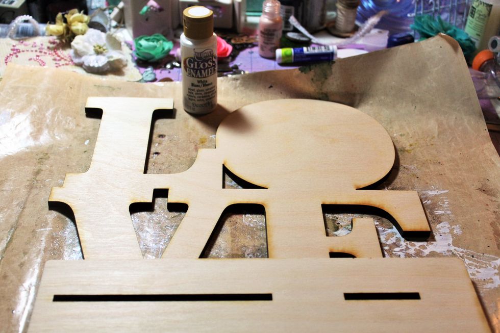 First cover the front and back with gesso or the paint included in the project add on.