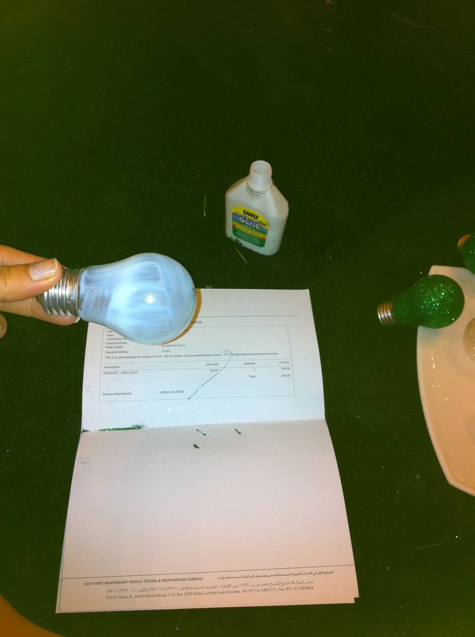 First cover the lamps with glue using brush.