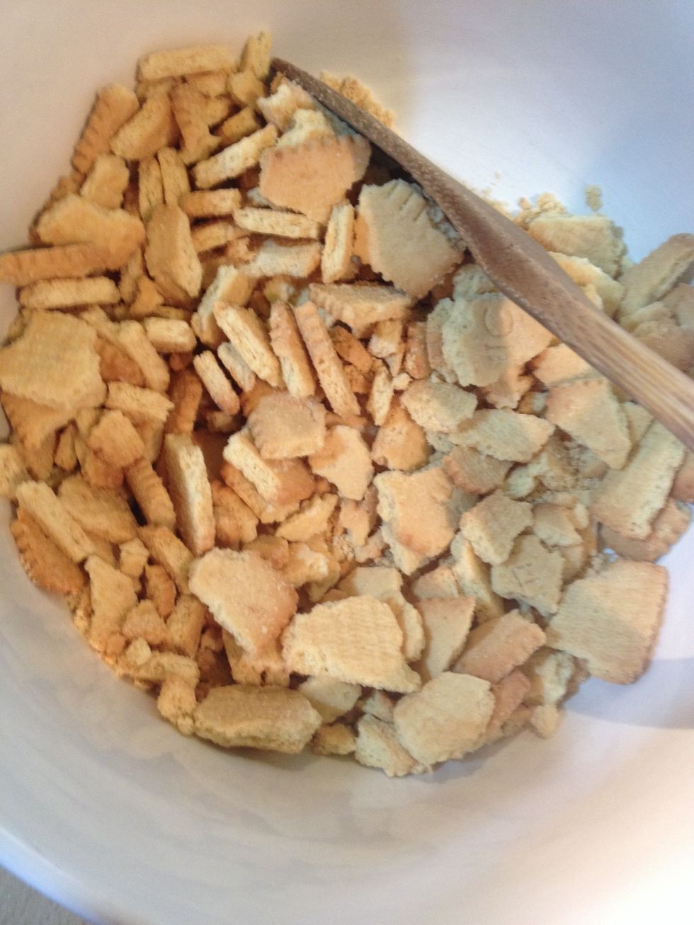 First, crush you biscuits. You want some chunky but most very fine. You can't see the fine ones here because crumbs fall to the bottom.