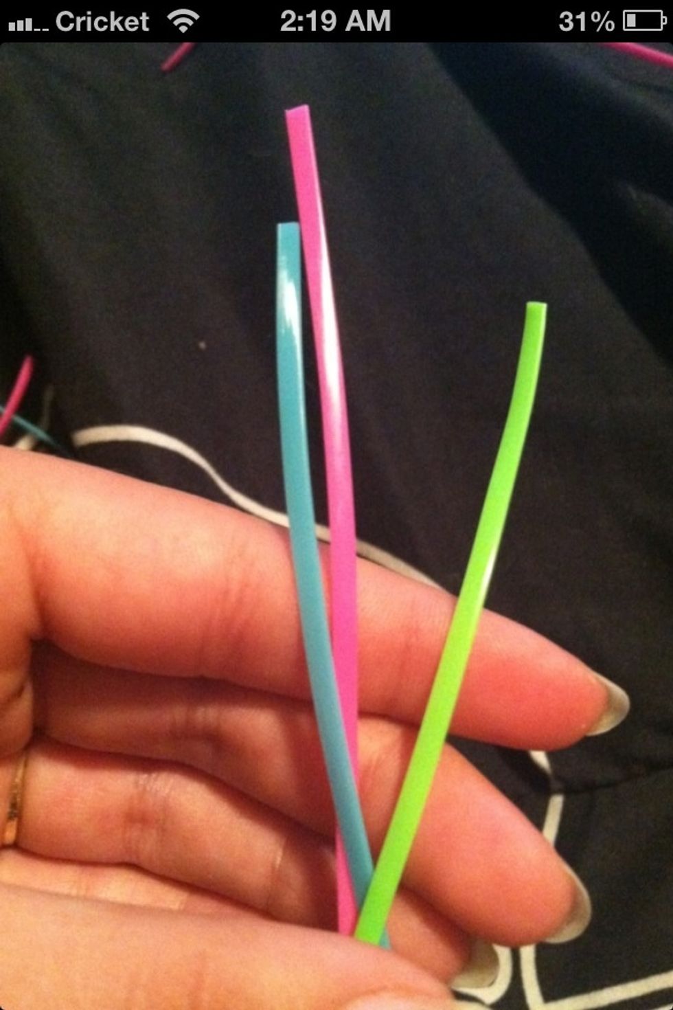 First cut 3 strings of craft lace the length of fingertip to shoulder blade.