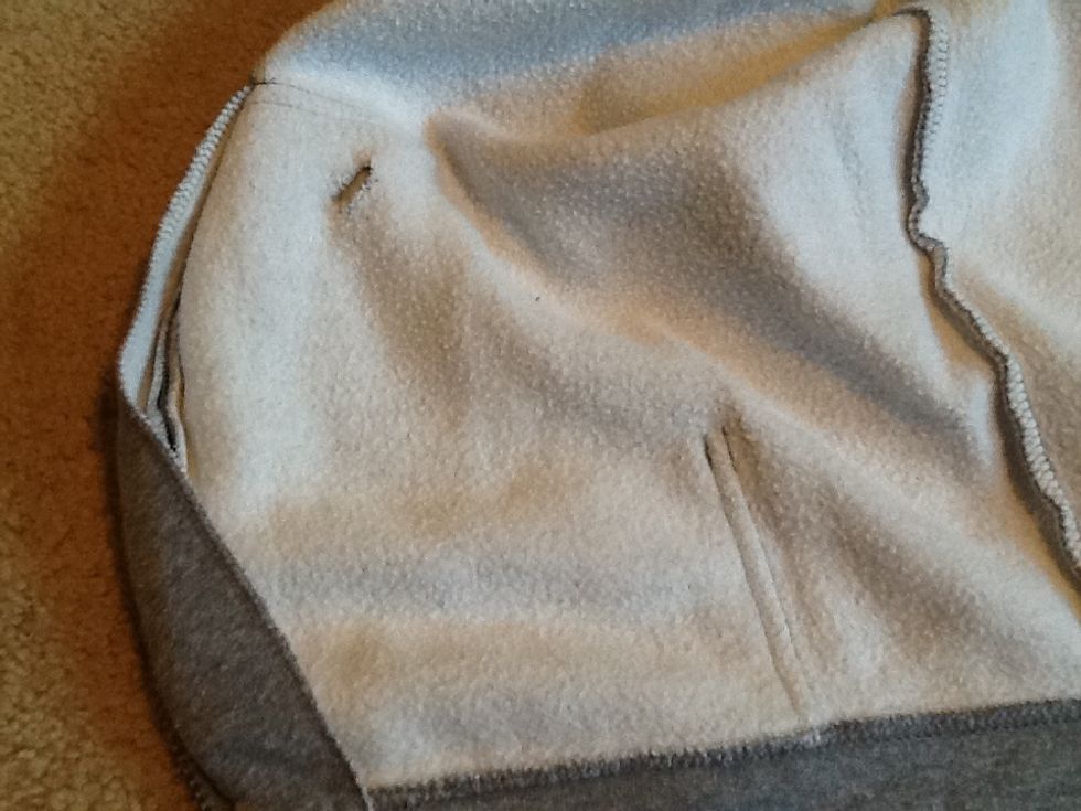 First cut a hole in the pocket which you will be placing your device into