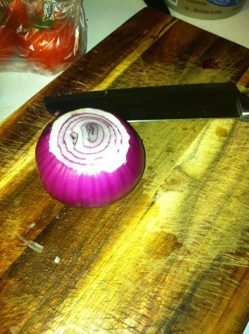 First cut off the ends of your onion. Then peel of the dried outer layer. It should look like this.