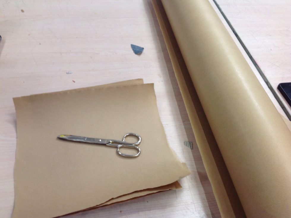 First cut paper into four layers roughly the same size squares