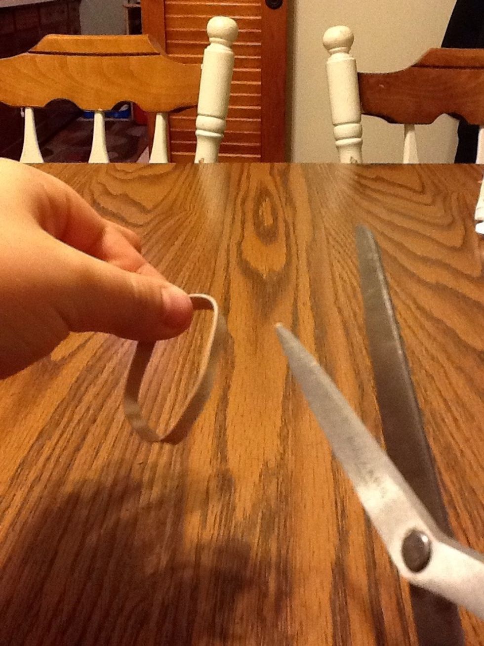 First cut the rubber band