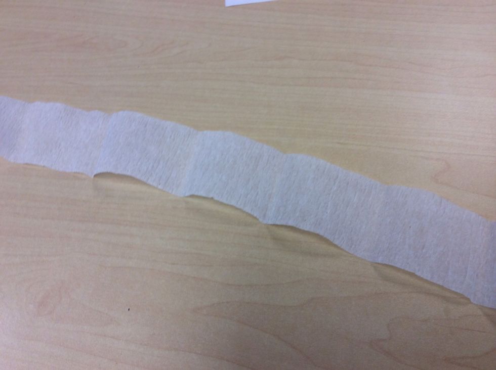 First , cut the tissue paper . For how big you want the flower to be .