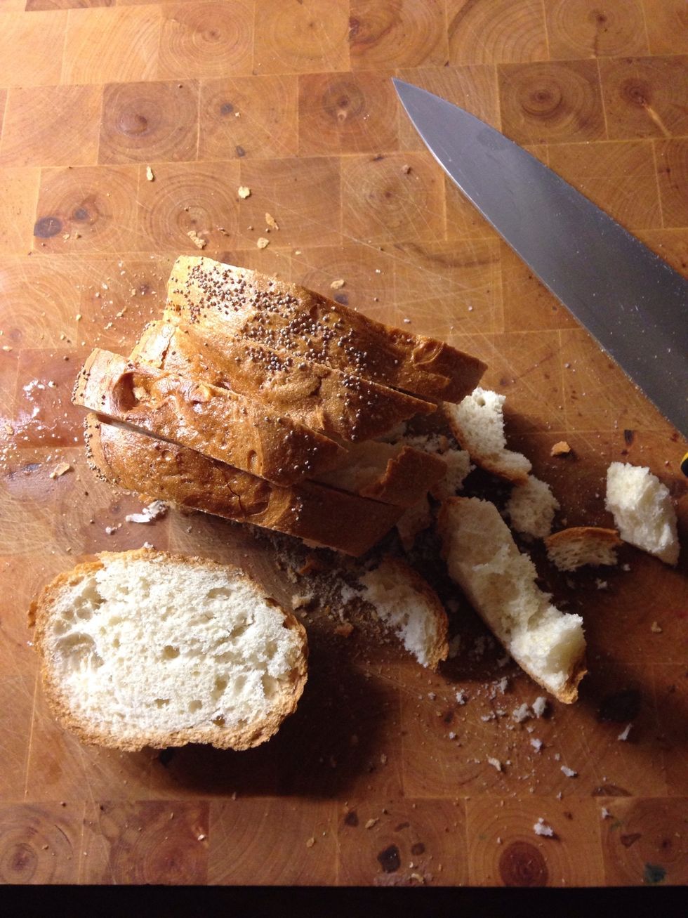 First Cut your bread. When i have a pice of dry bread i Cut it in small pieces and save it in a jar until the next time i bake. Bevare of mould though. Only dry bread!!