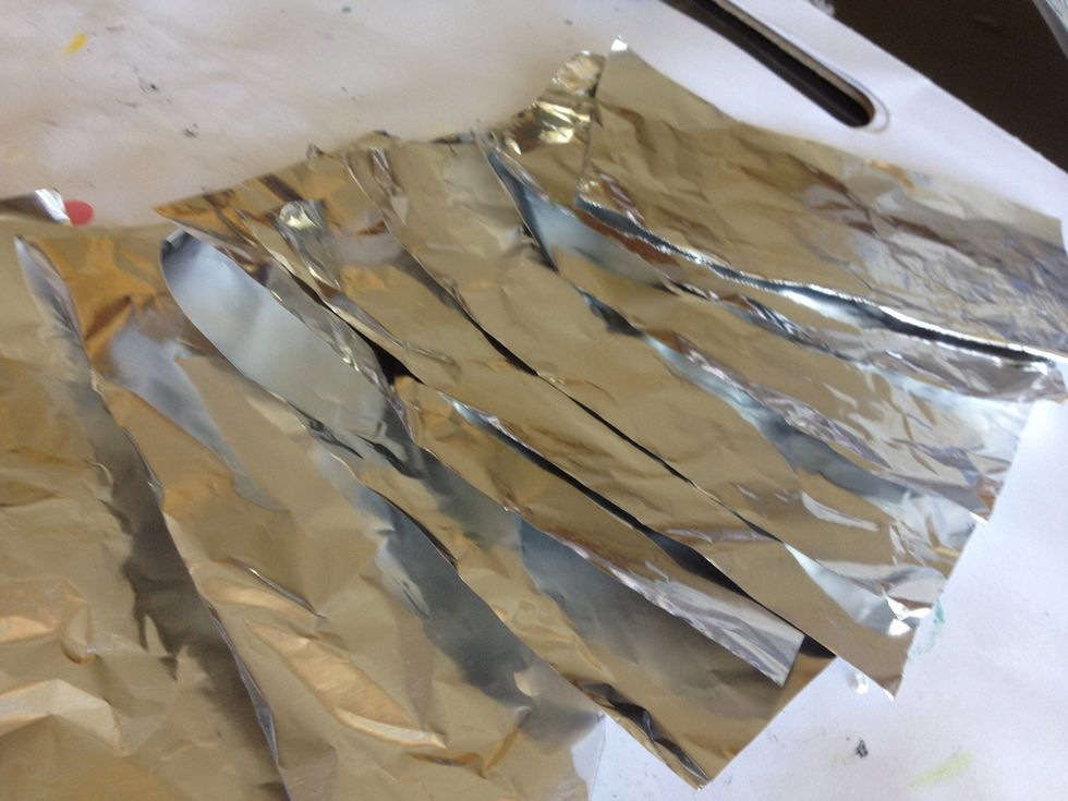 First cut your foil into 10 strips.