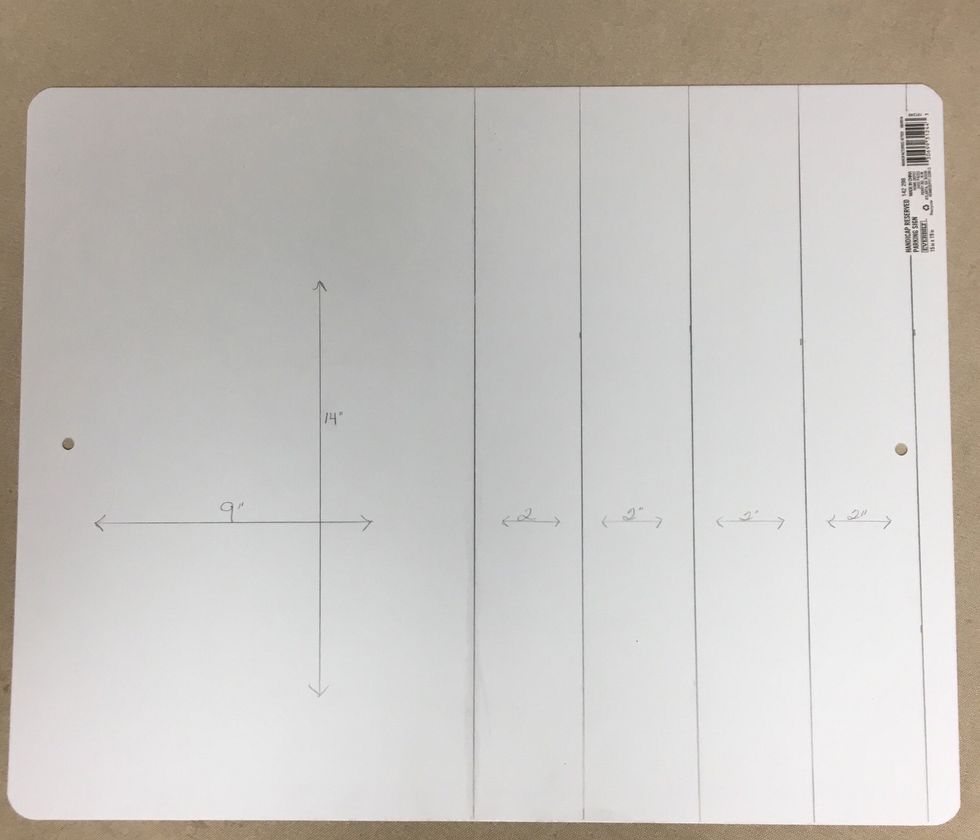 First determine how big you want your basket to be. We decided ours would be 9 x 14 with 2" sides, however we ended up trimming them down to 1 1/2". Then we drew the lines on the back of the sign.