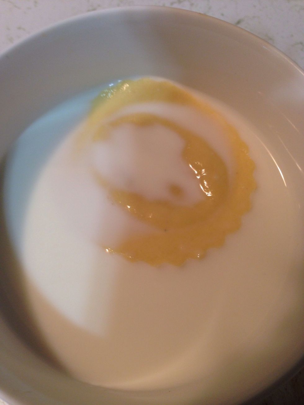 First, dip the ravioli in the milk.