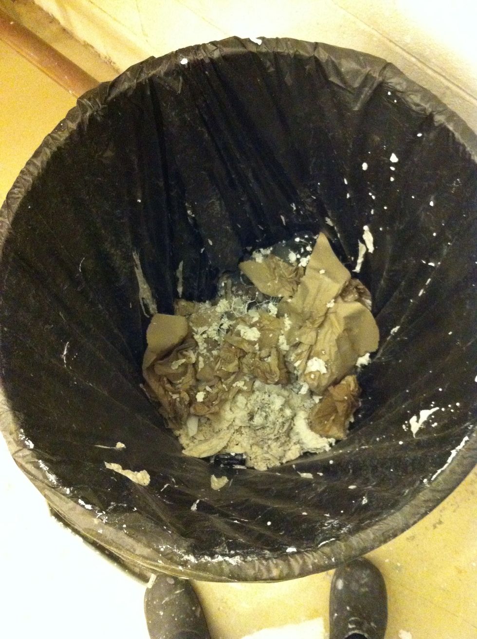 First discard any remaining plaster in the trash.