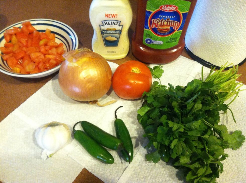 First do the Preparation : Chop the following into small cubes :Onions, tomato, and Serrano. For the garlic you need to use a garlic presser. Cilantro will be sliced as thin and tiny as possibl\u27a1