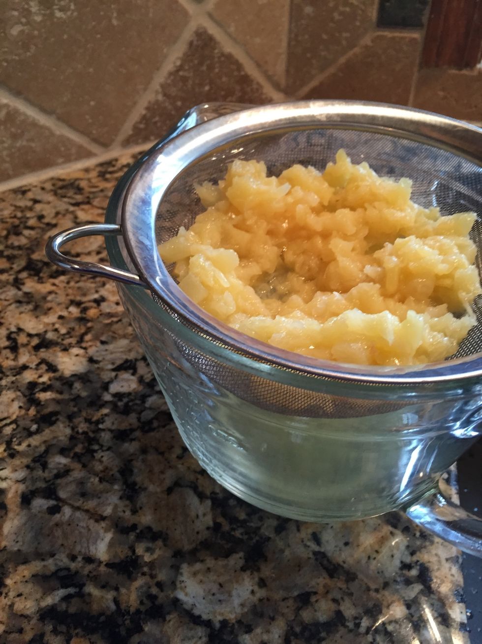 First, drain a 15 oz can of crushed pineapple. Save that juice! You'll use it when you make the custard