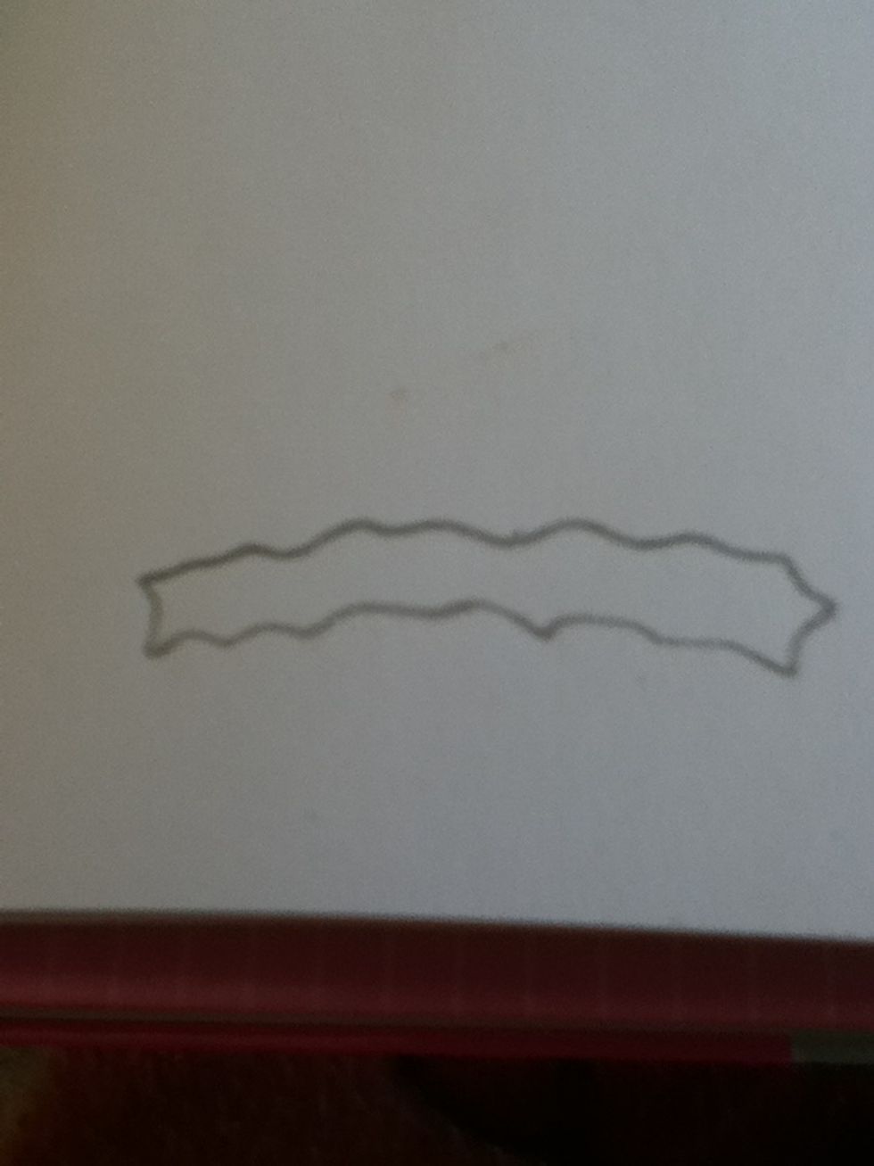First draw a bumpy oval like this