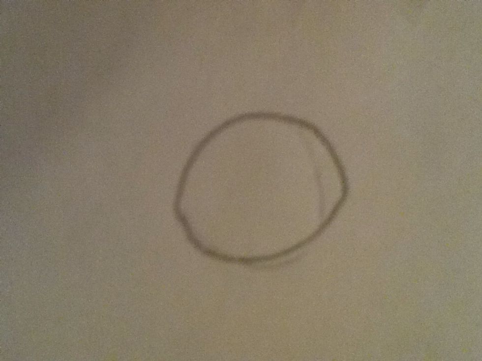 First draw a circle for the head