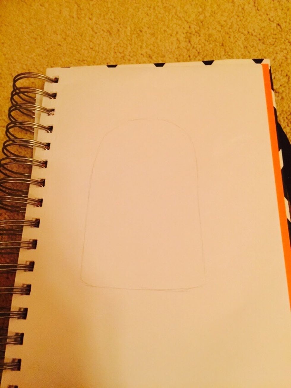 First draw an oval with a straight bottom