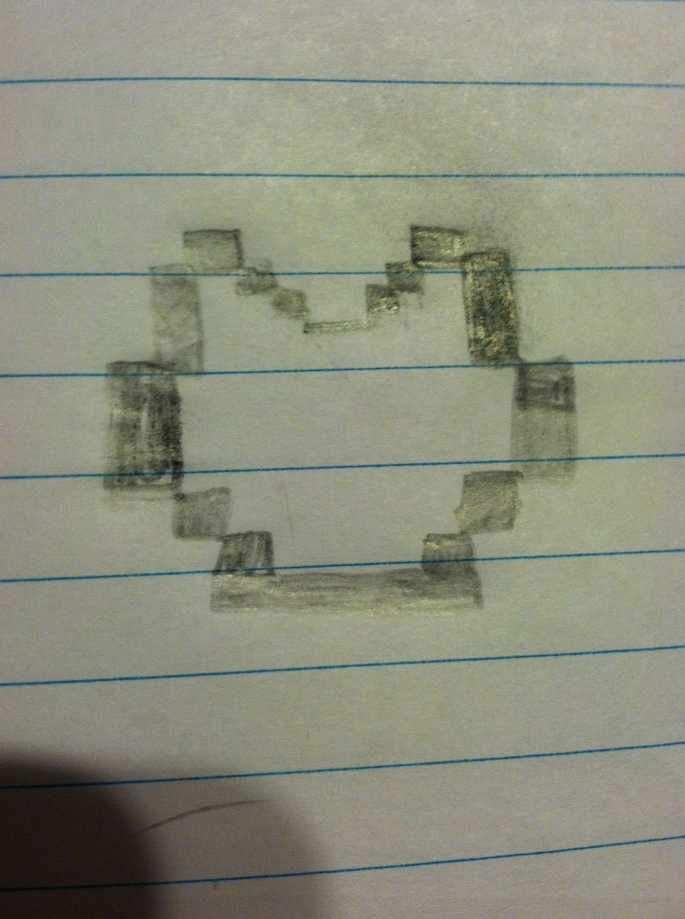 First draw Nyan Cat's head. Draw the squares/rectangles first then shade them in.